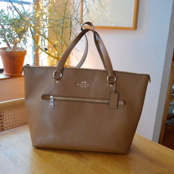 Coach Handbags - Pre-owned Coach Zip Top Tote with Side Zippered Pocket and Frayed Handles